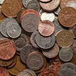 a pile of different types of coins