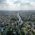 an aerial view of a river running through a city