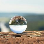 clear marble on brown rock