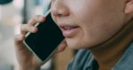 A woman is talking on a cell phone