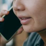 A woman is talking on a cell phone