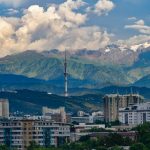 a city with a mountain in the background